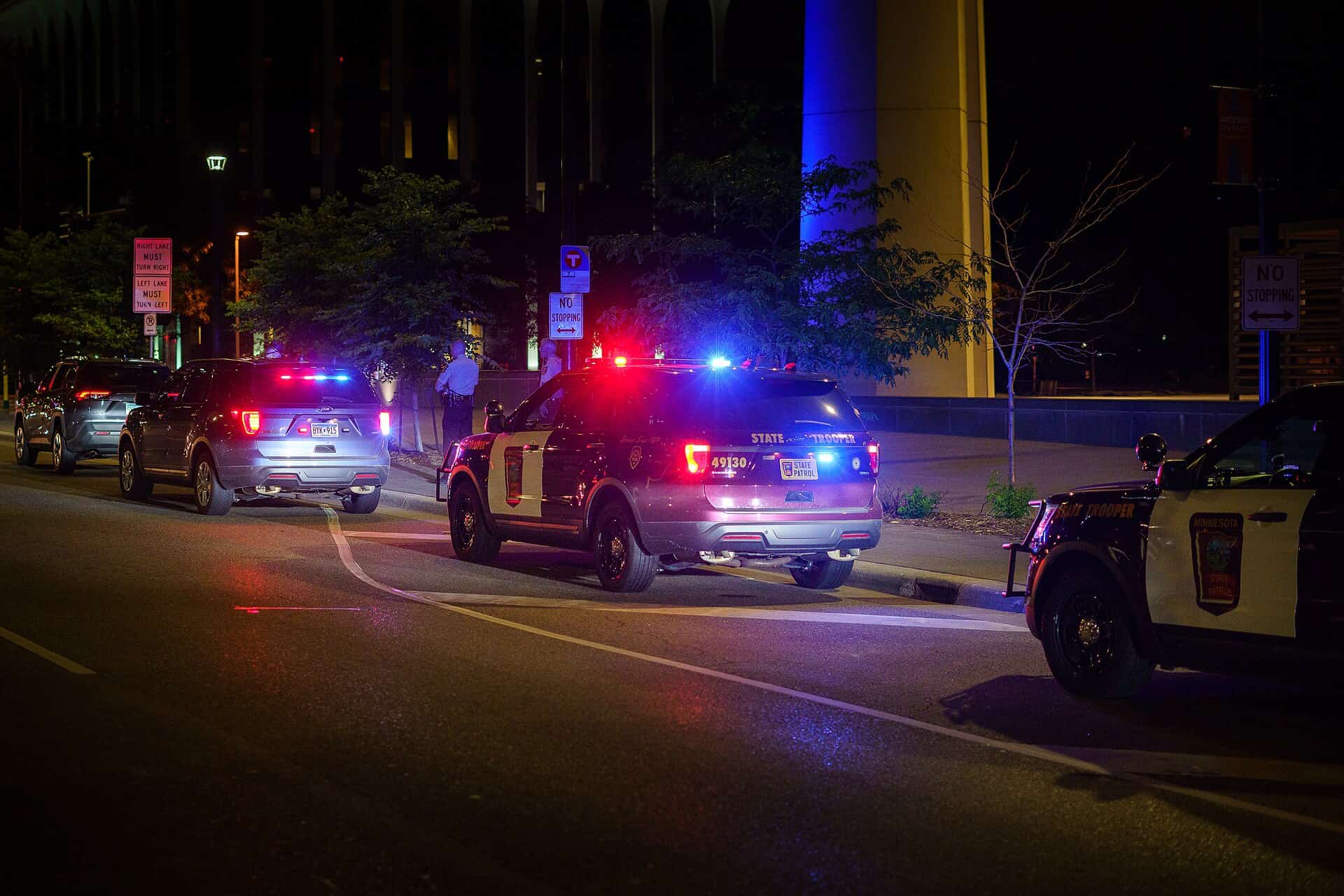 Patrol cars with emergency lights during a nighttime traffic stop, DUII defense in Oregon